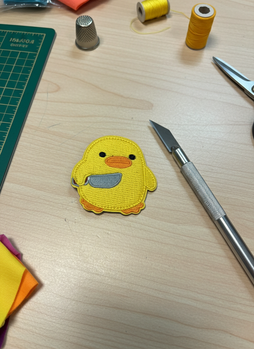 Duck patch with hook-and-loop knife