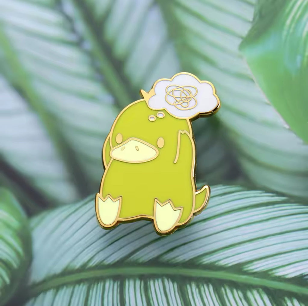 Pin's Canard Jaune Embrouillé