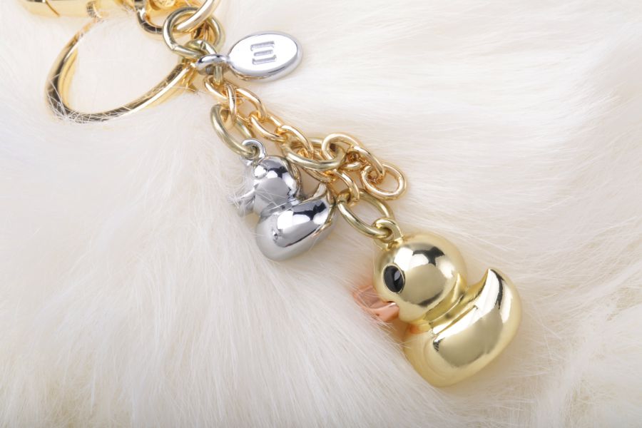 Bijou de Sac Canard Doré Pompon